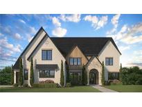 Inviting two-story home with a brick facade, detailed trim, and a lush green lawn at 2013 Old Atlanta Rd, Cumming, GA 30041