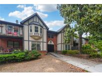Inviting condo showcasing a blend of Tudor and modern architecture with a charming garden setting and private balcony at 6851 Roswell Rd # E1, Atlanta, GA 30328