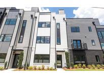 Modern townhome featuring a striking exterior with mixed materials and well-maintained landscaping at 1970 Dekalb Ne Ave # 9, Atlanta, GA 30307