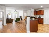 Open living area with hardwood floors, and access to a balcony at 390 17Th Nw St # 1063, Atlanta, GA 30363