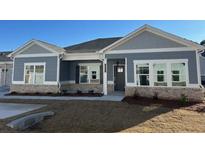 New construction home featuring gray siding, brick accents, and a covered porch at 3855 Shelleydale Dr, Powder Springs, GA 30127