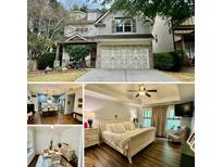 Two-story house with gray siding, brick accents, and a three-car garage at 253 Ascott Ln, Woodstock, GA 30189
