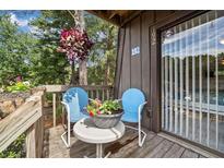 Inviting patio featuring outdoor furniture and peaceful views, perfect for relaxation by the outdoor pool at 3200 Rim Cove Dr # 192, Cumming, GA 30041
