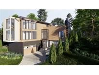 Modern home with expansive windows and a large driveway at 753 Crestridge Ne Dr, Atlanta, GA 30306