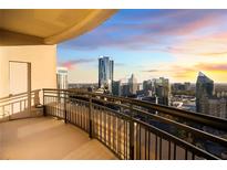 Breathtaking balcony view overlooking the city skyline at sunset, perfect for relaxing and enjoying the scenery at 3445 Stratford Ne Rd # 3601, Atlanta, GA 30326