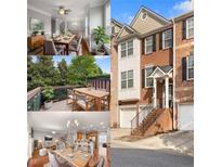 Brick three-story townhome with attached two-car garage, steps leading to covered entry, and a balcony at 5317 Concordia Pl, Mableton, GA 30126