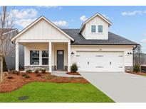 Charming single-Gathering home boasts a two-car garage and professionally landscaped front yard at 235 Strawberry Ln, Woodstock, GA 30189