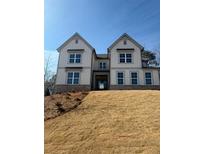 Two-story farmhouse-style home with white siding and stone accents at 202 Fountain Oak Way, Canton, GA 30114