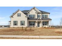 Beautiful two-story home featuring a classic design and a well-manicured front yard at 271 Arwen Lot 67 Dr, Mcdonough, GA 30252