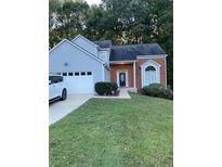 Charming single Gathering home featuring a two-car garage and nicely maintained lawn at 3370 Knighton Rdg, Powder Springs, GA 30127