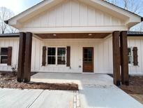 Craftsman style home with front porch and dark brown accents at 157 Clay Wade Dr, Canton, GA 30114