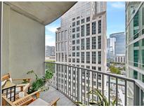 Relaxing balcony with city views and seating at 943 Peachtree Ne St # 801, Atlanta, GA 30309