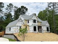 New construction home featuring modern design elements and a spacious layout in a private, wooded setting at 440 Allyson Cir, Alpharetta, GA 30009