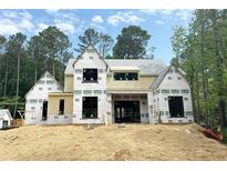 New home construction features a modern design, large windows, and durable house wrap at 440 Allyson Cir, Alpharetta, GA 30009