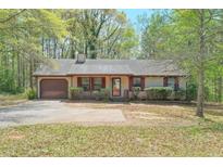 Charming single-story home with a well-maintained front yard and a cozy, inviting atmosphere at 798 Tommy Lee Cook Rd, Palmetto, GA 30268