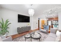 Bright living space with hardwood floors, modern lighting, and an open floor plan at 400 17Th Nw St # 2120, Atlanta, GA 30363