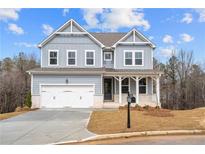 Charming two-story home with a two car garage and beautifully landscaped front yard at 109 Laurelwood Ln, Dallas, GA 30157