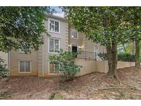 Charming two-story home featuring multiple windows, elegant trim, and tasteful exterior lighting at 10 Braemore Dr, Sandy Springs, GA 30328