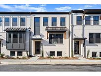 Modern townhome with white brick exterior and dark accents at 314 Cornett Way, Lawrenceville, GA 30046