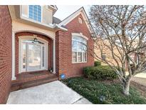 Brick home with a welcoming front porch and landscaped yard at 1979 Spivey Village Dr, Jonesboro, GA 30236