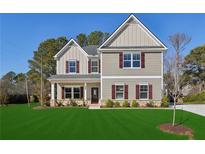 Two-story house with gray siding, burgundy shutters, and a well-manicured lawn at 3603 Squires Park Ln, Loganville, GA 30052