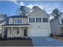 Two-story house with white siding, gray door, and attached garage at 799 River Gardens Se Dr, Atlanta, GA 30354