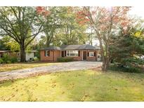 Charming one story brick home with long driveway and beautiful front yard at 6332 N Hampton Dr, Atlanta, GA 30328