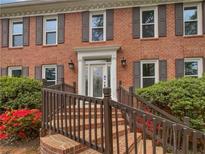 Charming brick home featuring a beautifully landscaped yard and inviting entrance at 3549 Meadow Chase Dr, Marietta, GA 30062