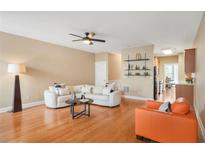 Spacious living room with hardwood floors, fireplace and neutral color palette at 5030 Bayrose Cir # 30A, Atlanta, GA 30344