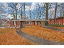 Charming brick home featuring a walkway and a covered carport at 1350 Ruth, Decatur, GA 30035