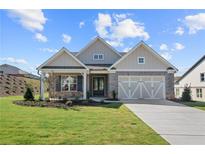 Brick front exterior of charming craftsman home with a large covered porch at 2735 Marie Way, Cumming, GA 30028