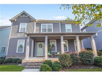 Charming two-story home features a welcoming front porch and beautifully landscaped front yard at 3210 Ancoats St, Douglasville, GA 30135