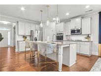 Modern kitchen with stainless steel appliances and an island at 3210 Ancoats St, Douglasville, GA 30135