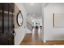 Bright entryway with hardwood floors, leading to the living room at 6073 Marigold Way, Atlanta, GA 30349
