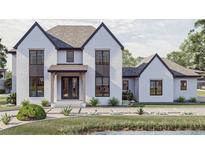 Two-story white brick home with black accents, and a landscaped front yard at 1276 A Rutledge Rd, Acworth, GA 30101