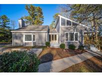 Newly renovated gray house with updated landscaping at 6724 Oakland Dr, Douglasville, GA 30135