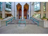 Striking building entrance with architectural details, double doors, and accessible ramp at 2870 Pharr Court South Nw # 2602, Atlanta, GA 30305