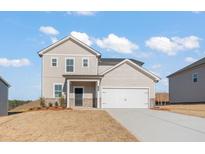 Charming two-story home with a two-car garage and a welcoming front porch at 4183 Viola Pl, Atlanta, GA 30349