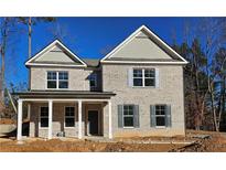 Two-story house with gray brick and a covered porch at 4505 Ajo Walk, Atlanta, GA 30331