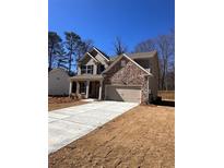 Beautiful new construction home featuring a stone facade and a two-car garage at 2260 Highridge Point Dr, Lithia Springs, GA 30122