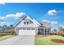 Craftsman style home with stone accents and a 2-car garage at 112 Laurel Farms Ln, Dallas, GA 30157