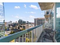 Spacious balcony with city views and small table and chairs at 3324 Peachtree Ne Rd # 1813, Atlanta, GA 30326