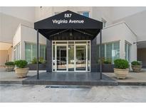 The building entrance features a covered awning and glass doors at 587 Virginia Ave # 805, Atlanta, GA 30306