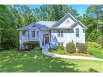 Charming traditional home featuring a manicured lawn and a light gray exterior at 27 Danbury Hill # Coweta, Sharpsburg, GA 30277