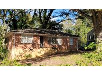 Brick ranch house with a tree-lined front yard at 340 Adelle Se St, Atlanta, GA 30315