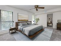 Spacious bedroom with large windows and wood platform bed at 811 Wynnes Ridge Se Cir, Marietta, GA 30067