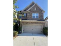 Charming two-story brick home features a spacious two car garage and manicured landscaping at 3380 Baylor Cir, Mcdonough, GA 30253