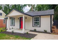 Charming craftsman bungalow with red door, covered porch, and landscaped yard at 599 Quillian Ave., Decatur, GA 30032