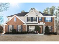 Brick two-story house with a large front yard and landscaping at 3829 Reece Farms Ct, Powder Springs, GA 30127