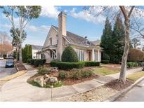 Charming home with brick exterior, manicured landscaping, and a classic architectural design at 6830 Vickery Creek Rd, Cumming, GA 30040